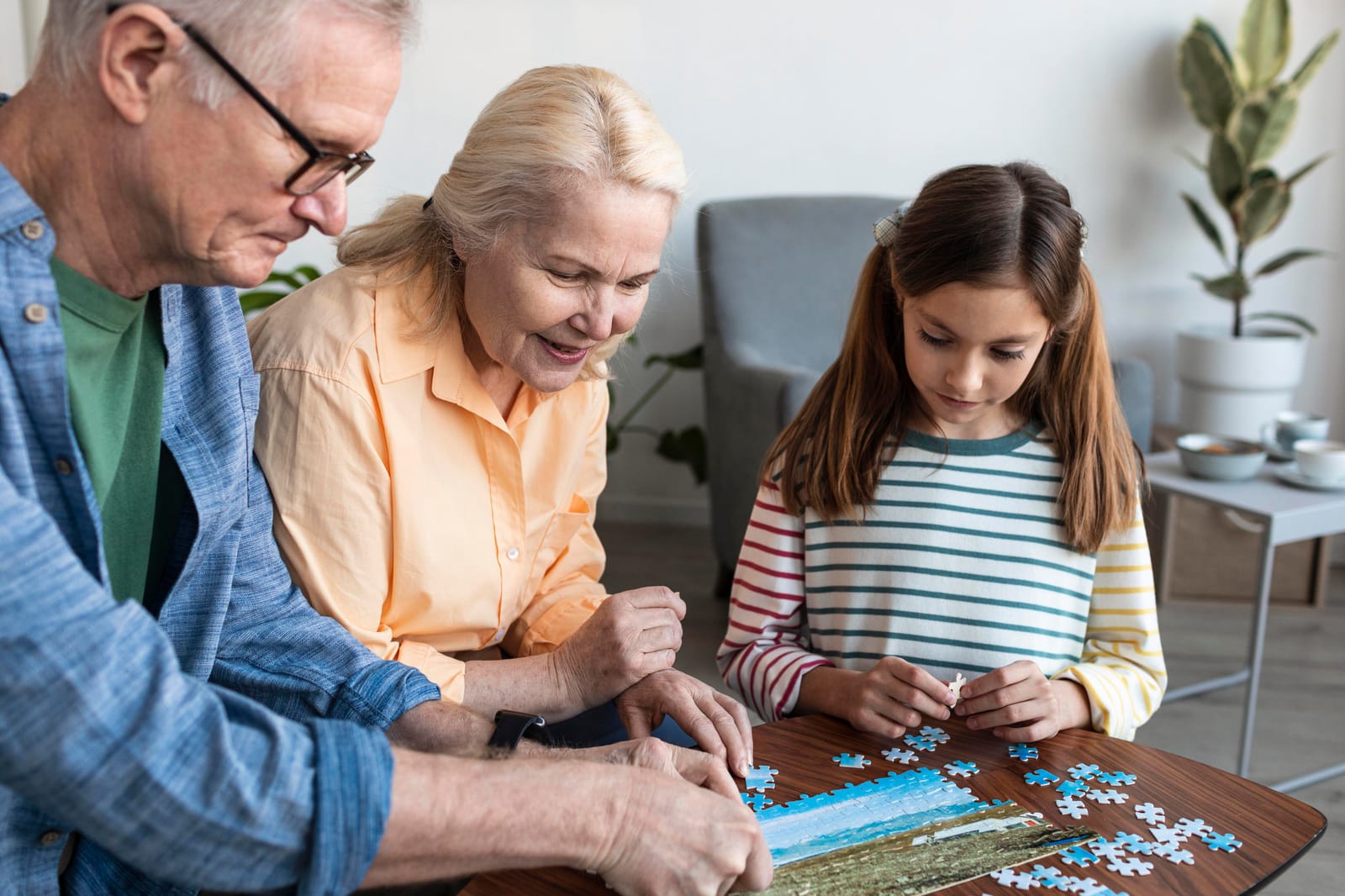 A multi-generational family doing a puzzle together at home